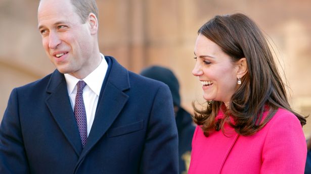 Prince William and Kate Middleton smiling together during royal visit