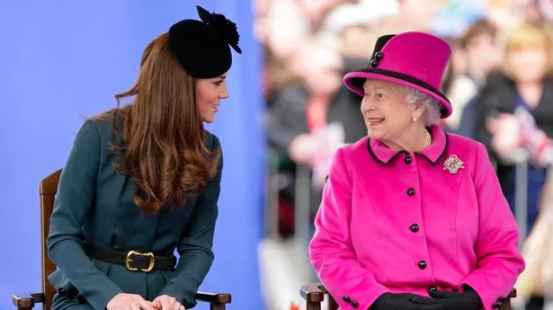 Kate Middleton and Queen Elizabeth II looking at each other and smiling