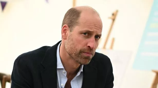 Prince William listening intently during a round table discussion